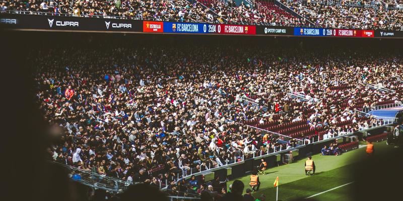 A bustling crowd enjoying a football match at Camp Nou Stadium, Barcelona.
