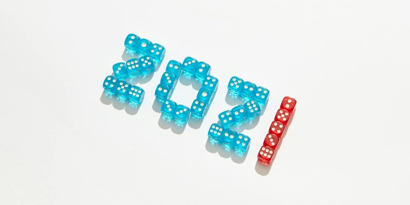 Blue and red dice forming the number '2021' on a white background.