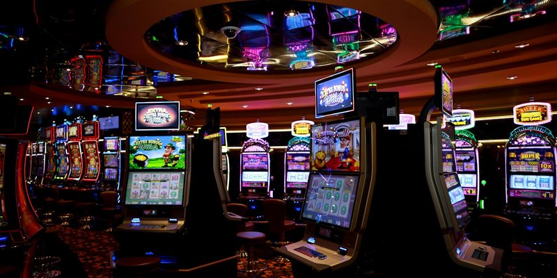 Vibrant casino floor with colorful slot machines and bright lights capturing a lively gaming atmosph